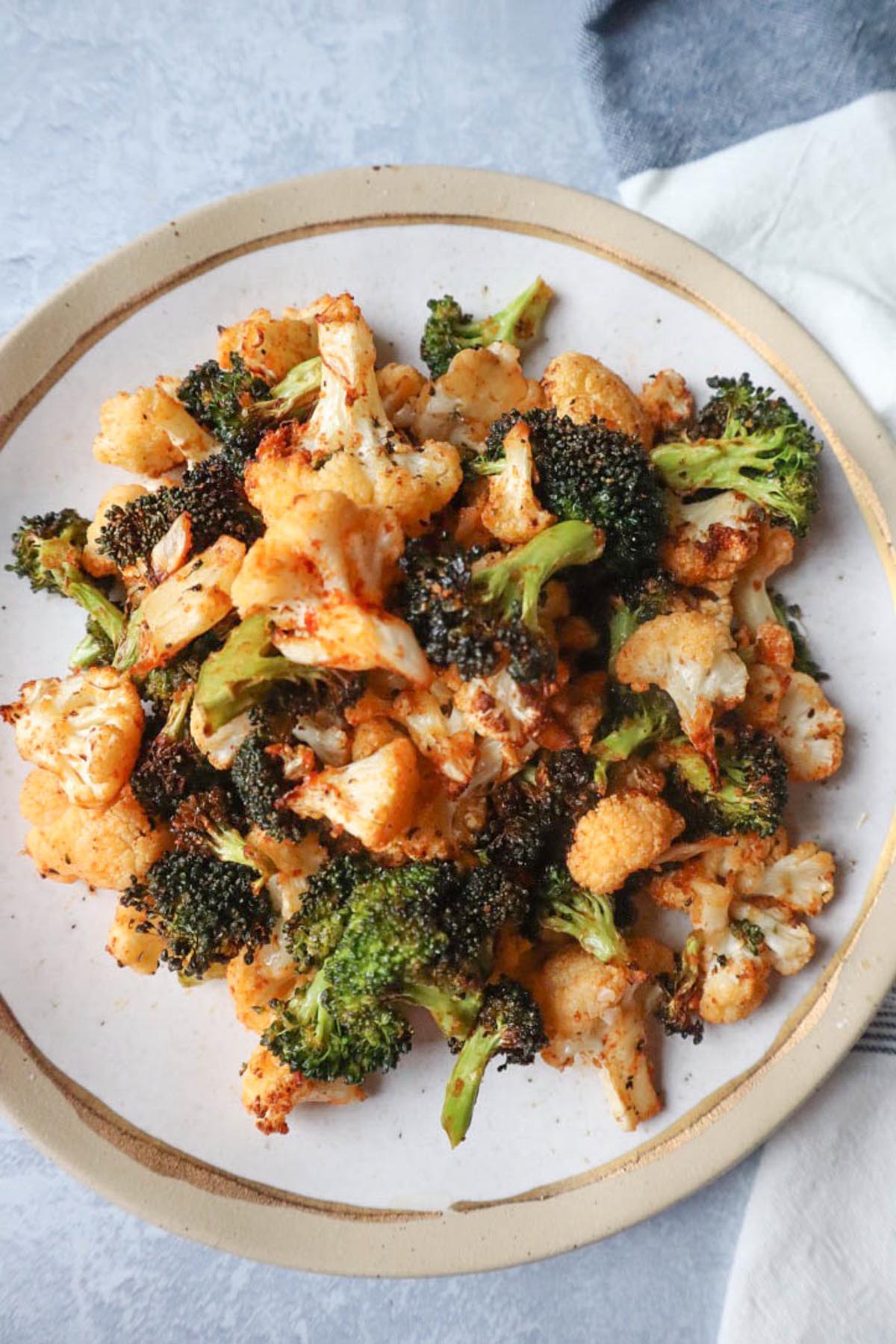 plate with air fried broccoli and cauliflower