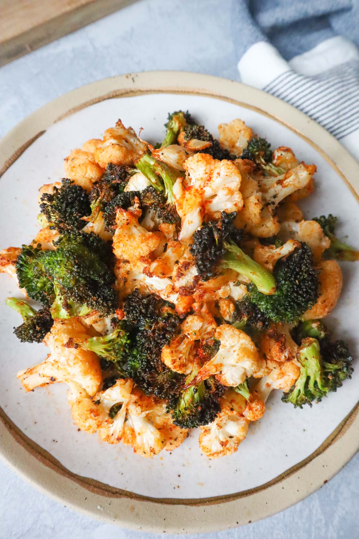 plate with air fried broccoli and cauliflower seasoned