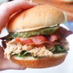 chicken bacon ranch sandwich with ranch shredded chicken, lettuce, bacon, and pickle