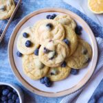 white plate with lemon blueberry cookies with blueberries