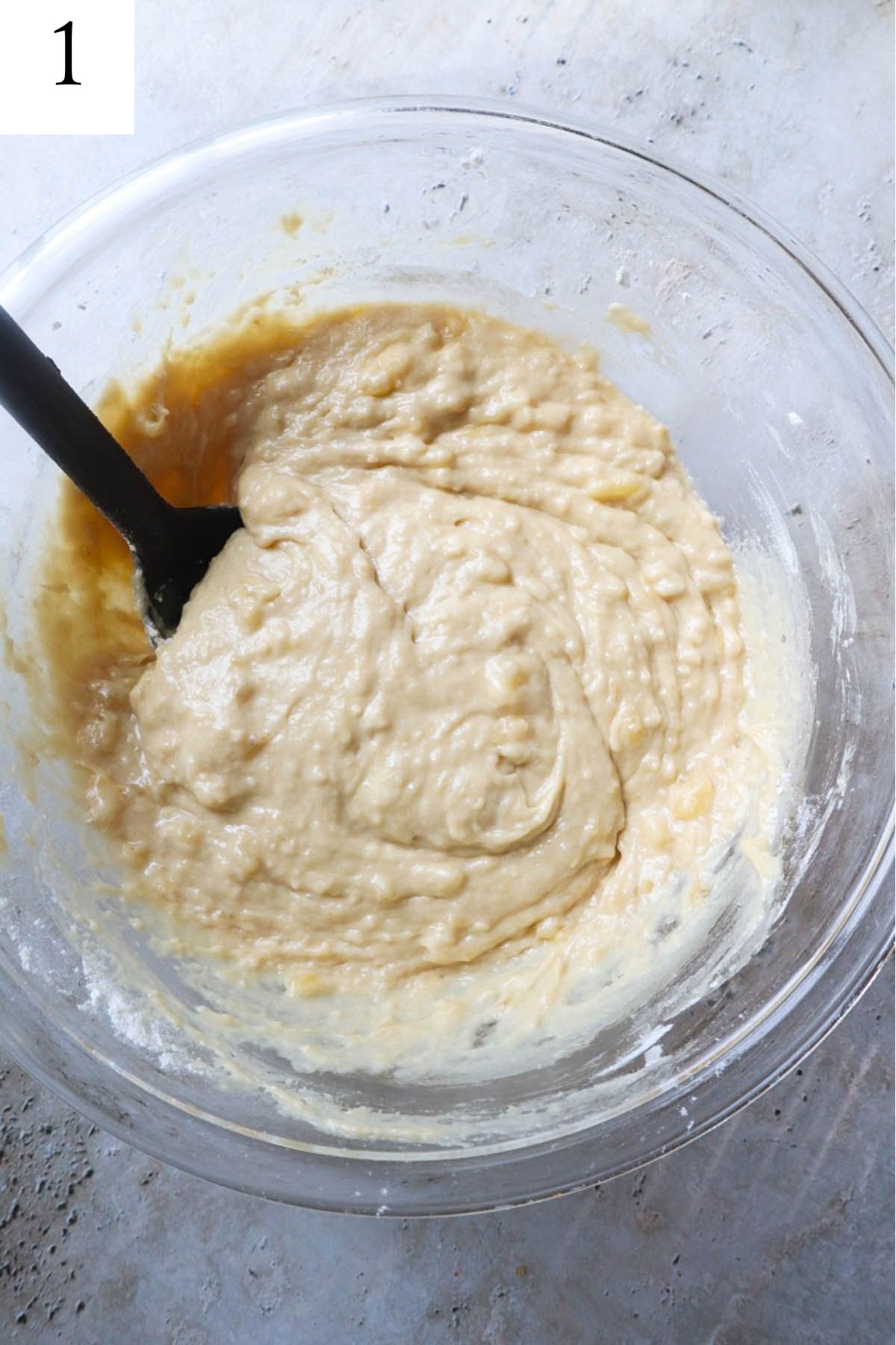 glass bowl with muffin batter.