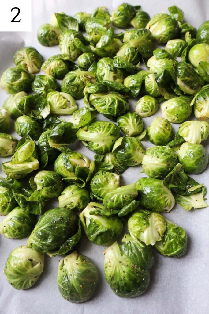 baking sheet with brussels sprouts sliced side down.