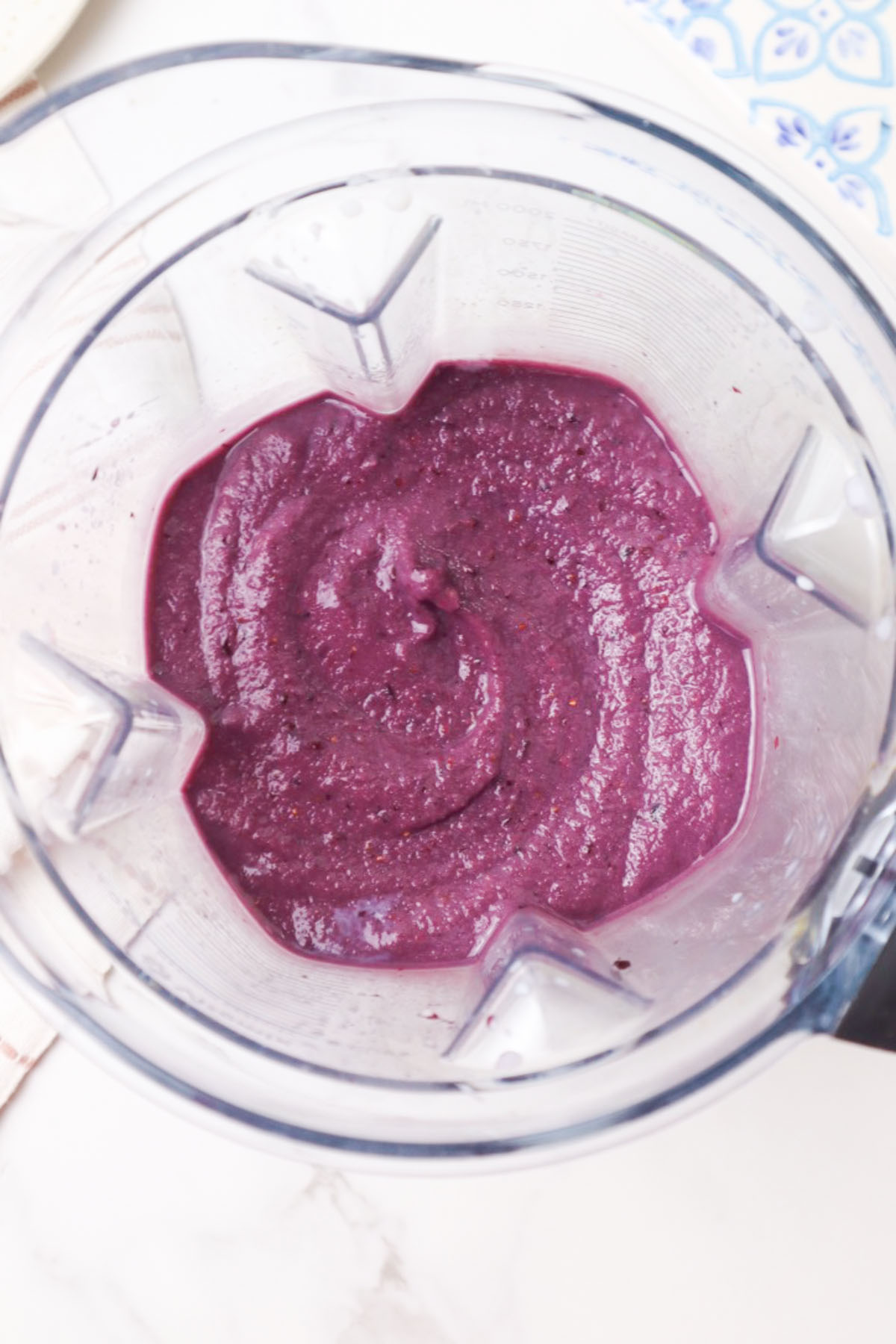 blender with smooth blackberry strawberry smoothie. 
