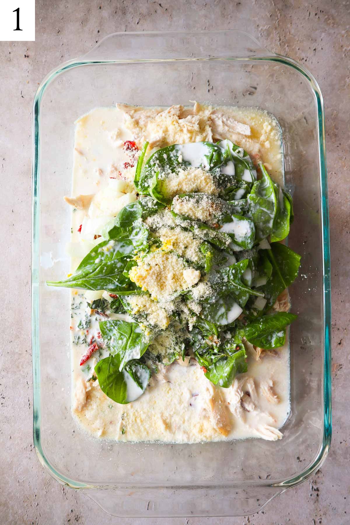 orzo, chicken, cheese, spinach half and half, and broth dumped into glass baking dish.