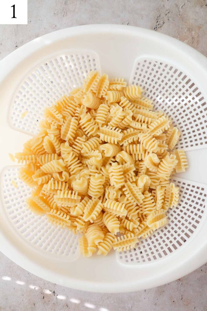 strainer with cooked pasta.