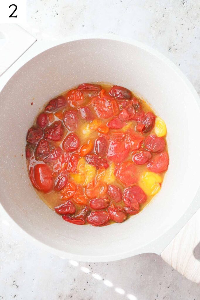 pot with cooked down cherry tomatoes.