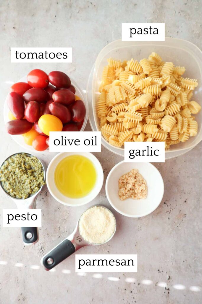 labeled and measured ingredients to make pesto pasta with cherry tomatoes.