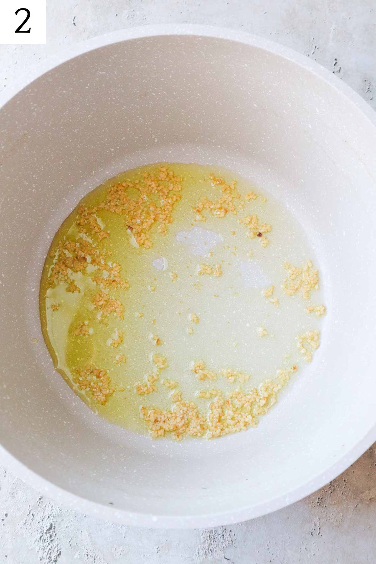 pot with olive oil and garlic.