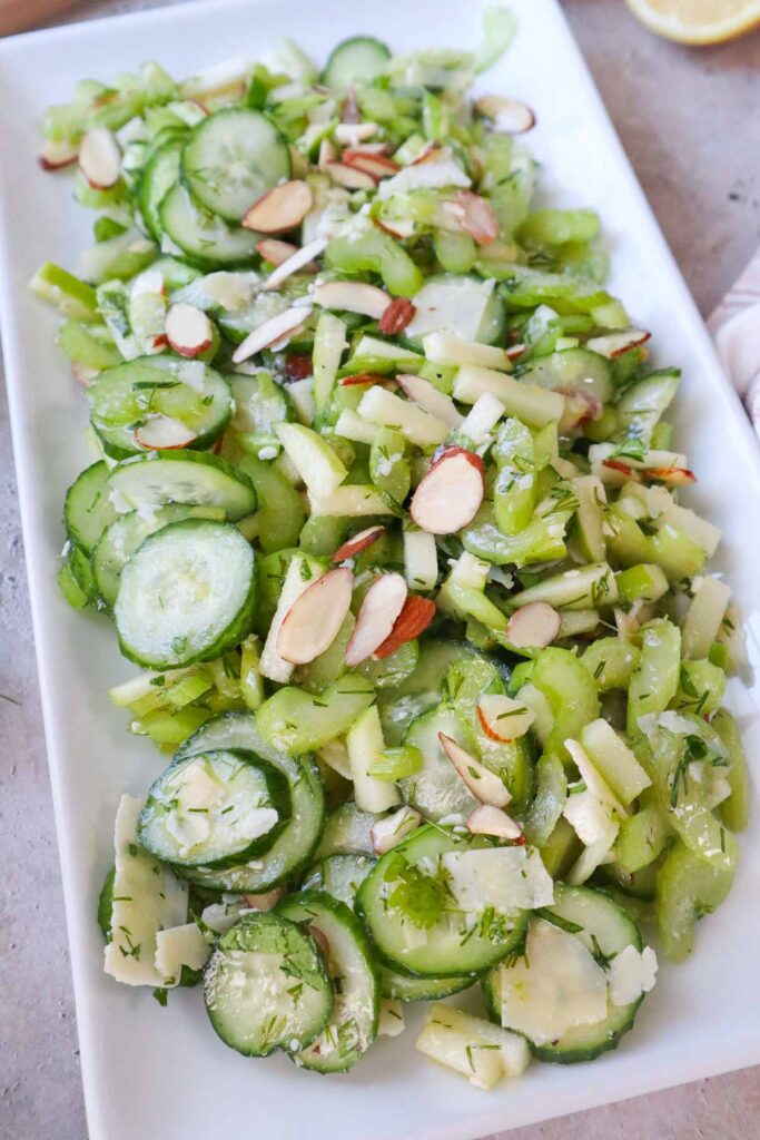 white rectangular plate of celery cucumber salad.