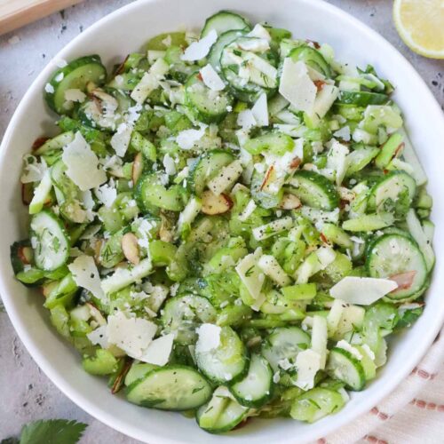 white bowl with celery cucumber salad.