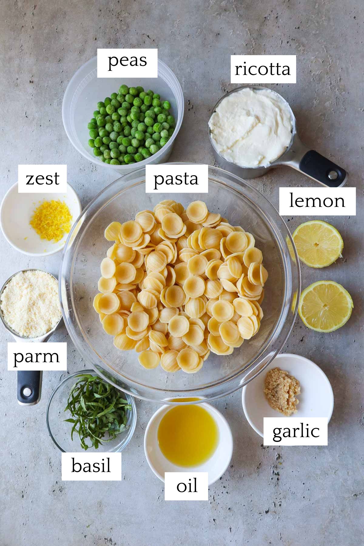 labeled and measured ingredients to make ricotta pasta and peas.
