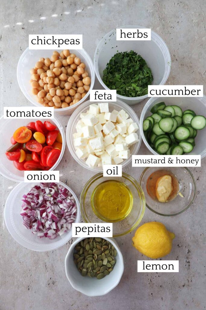 labeled and measured ingredients to make cucumber chickpea feta salad.