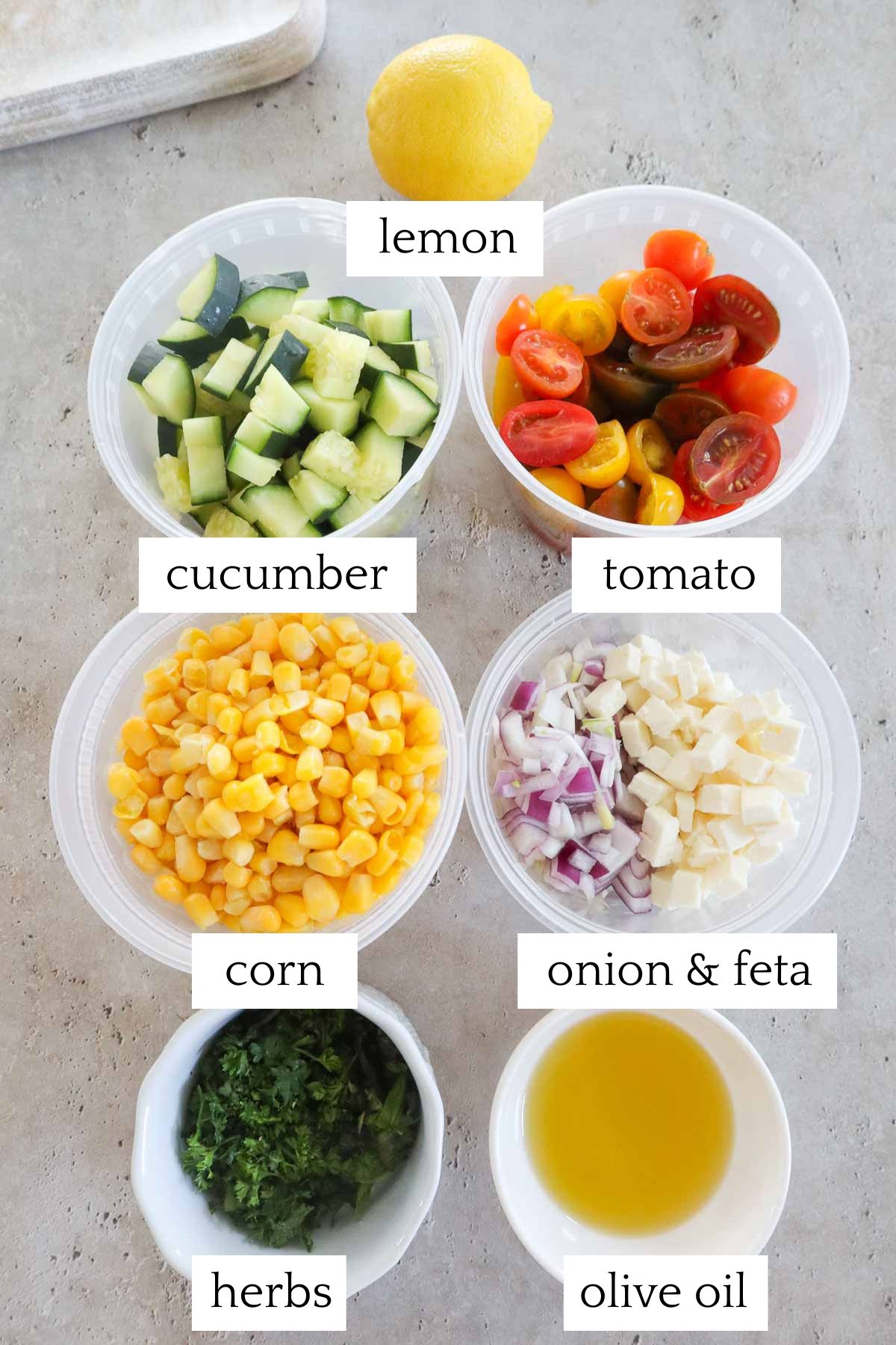 measured and labeled ingredients to make tomato corn cucumber salad.