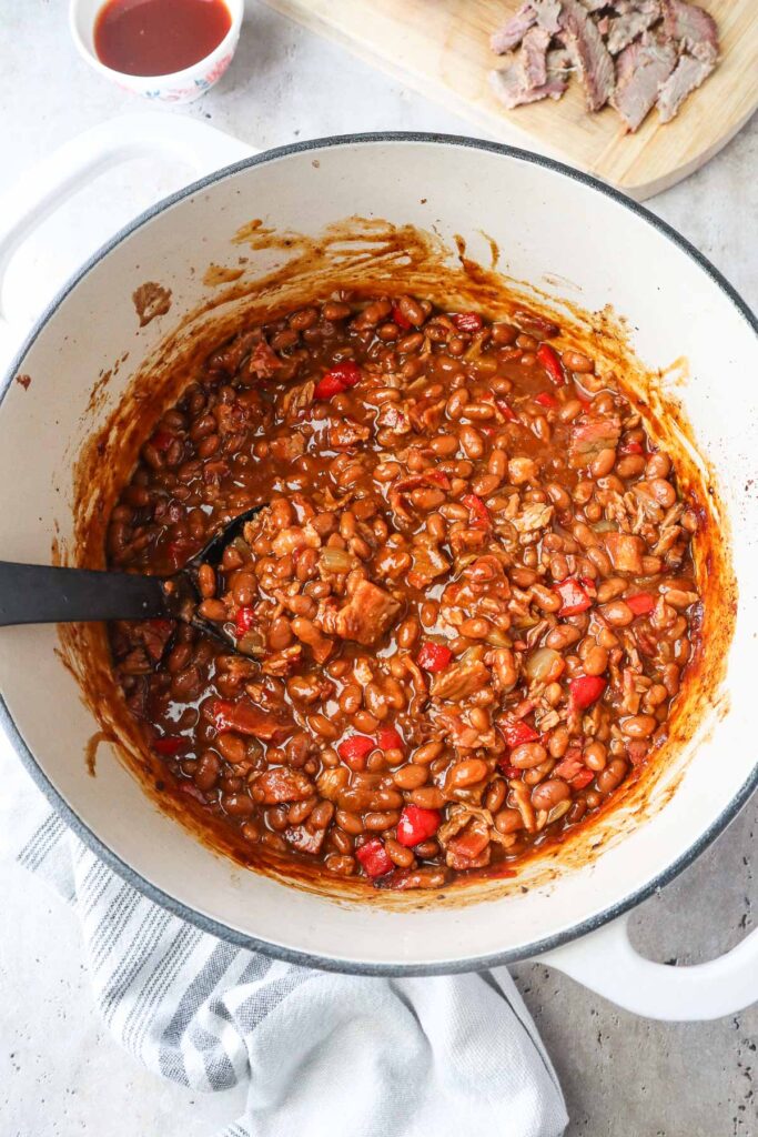 brisket baked beans in a dutch oven.