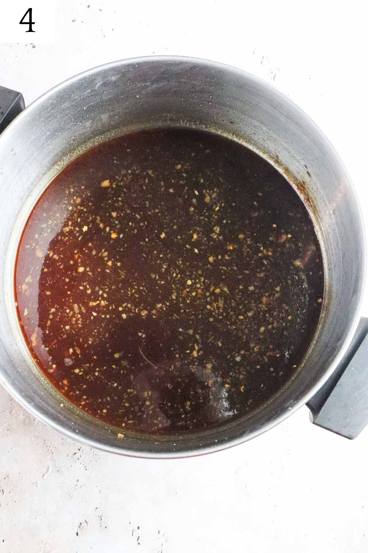 pot with all ingredients to make the sauce for bourbon chicken.