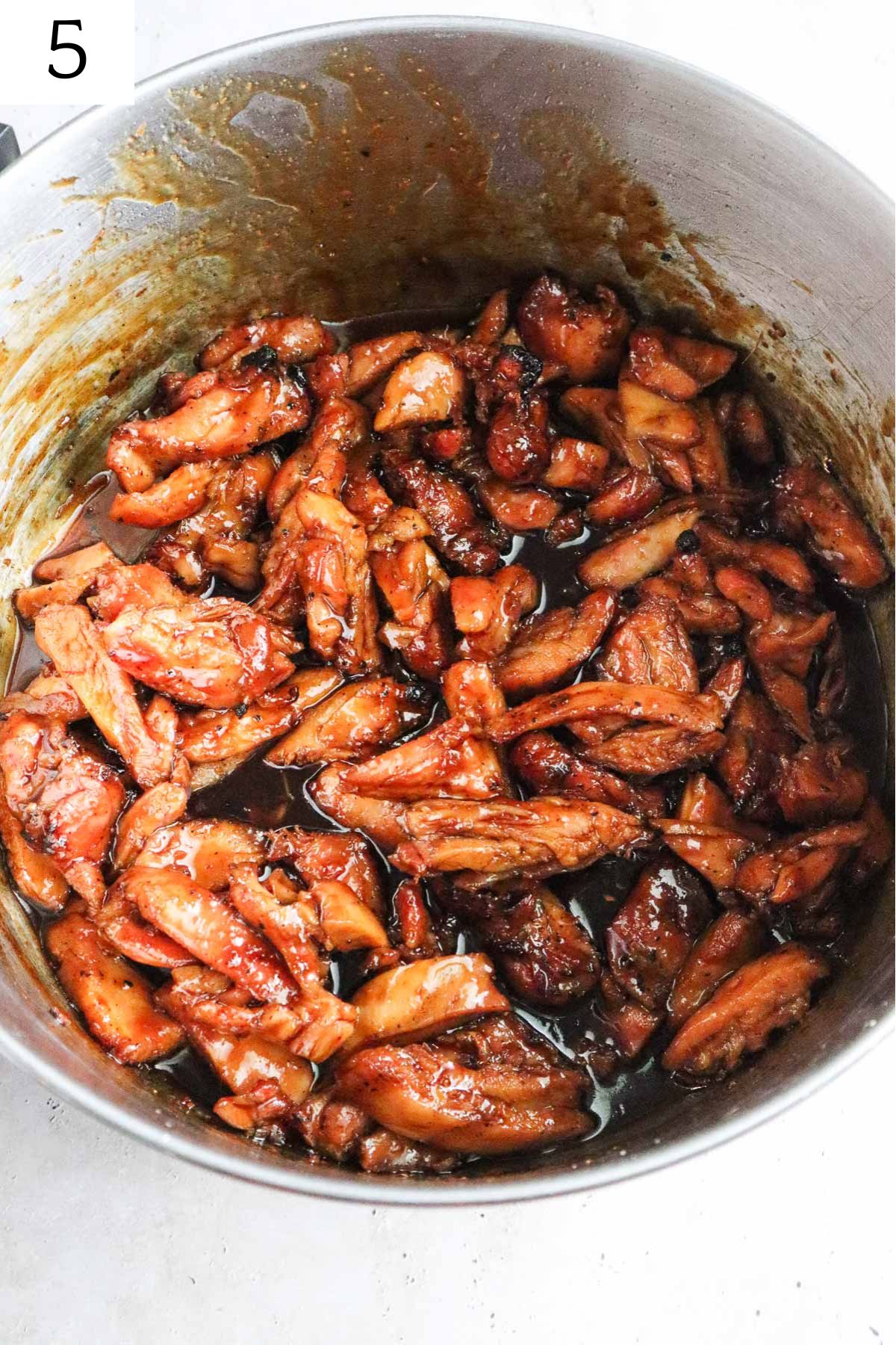 pot with chicken mixed into the bourbon sauce.