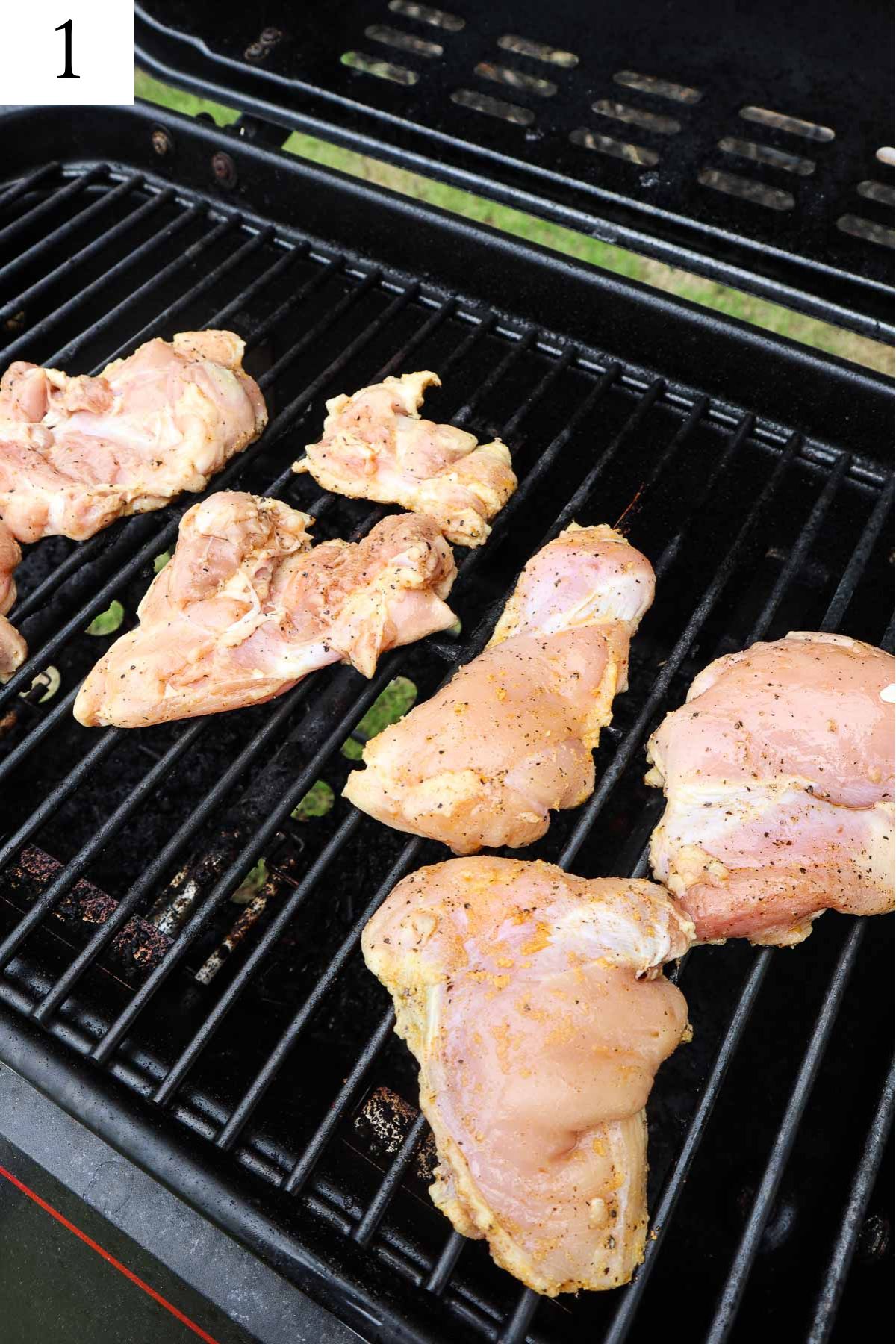 seasoned chicken thighs on the grill.