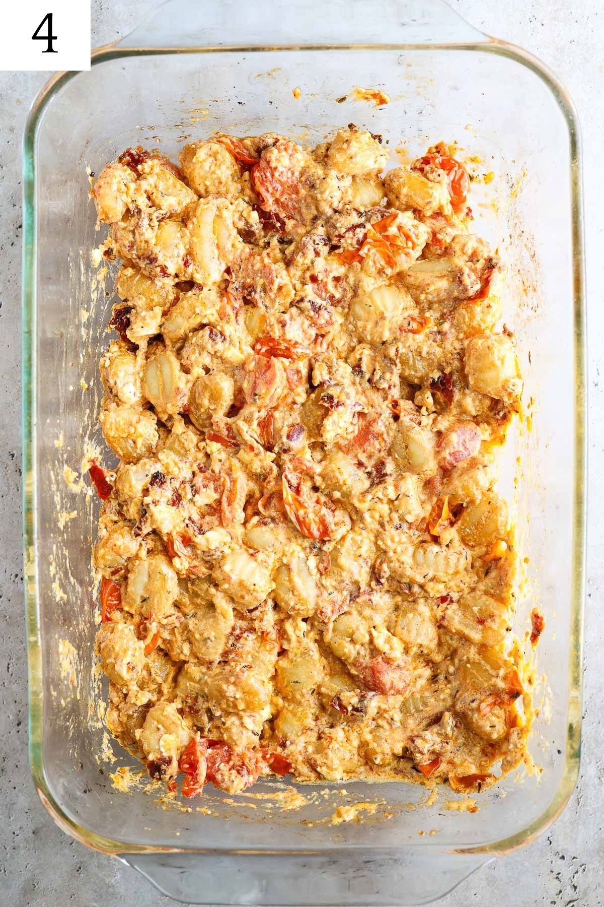 glass baking dish with creamy feta gnocchi fully baked.