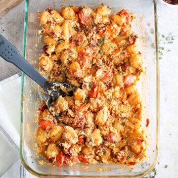 glass baking dish with fully baked feta gnocchi.
