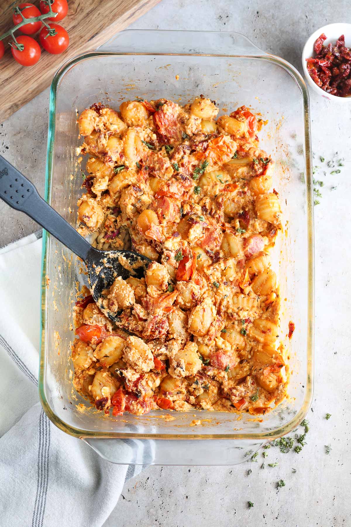 glass baking dish with fully baked feta gnocchi.